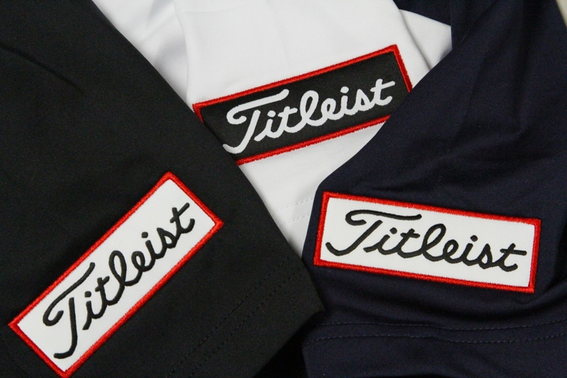 and a Titleist tour patch on the other.