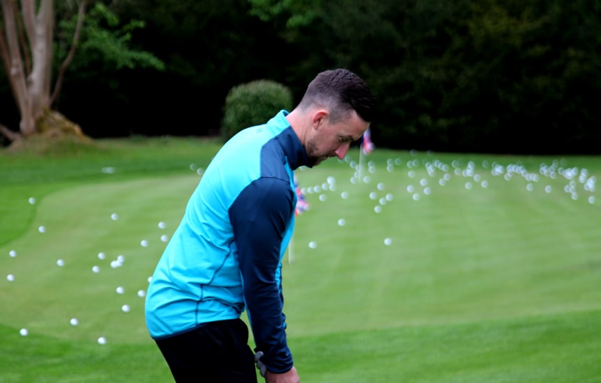Ross Holmes fine tuning his wedge game with the...