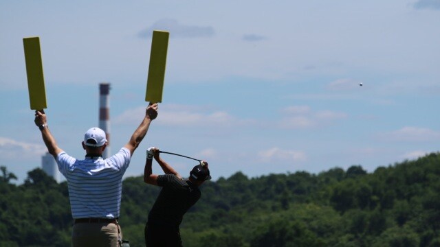 Joining him for the loop, is Titleist golf ball...