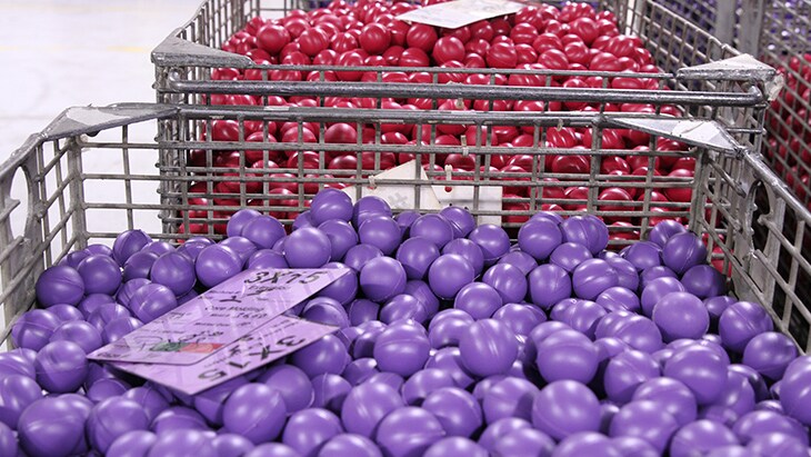 The molded cores are stored in large basket totes...