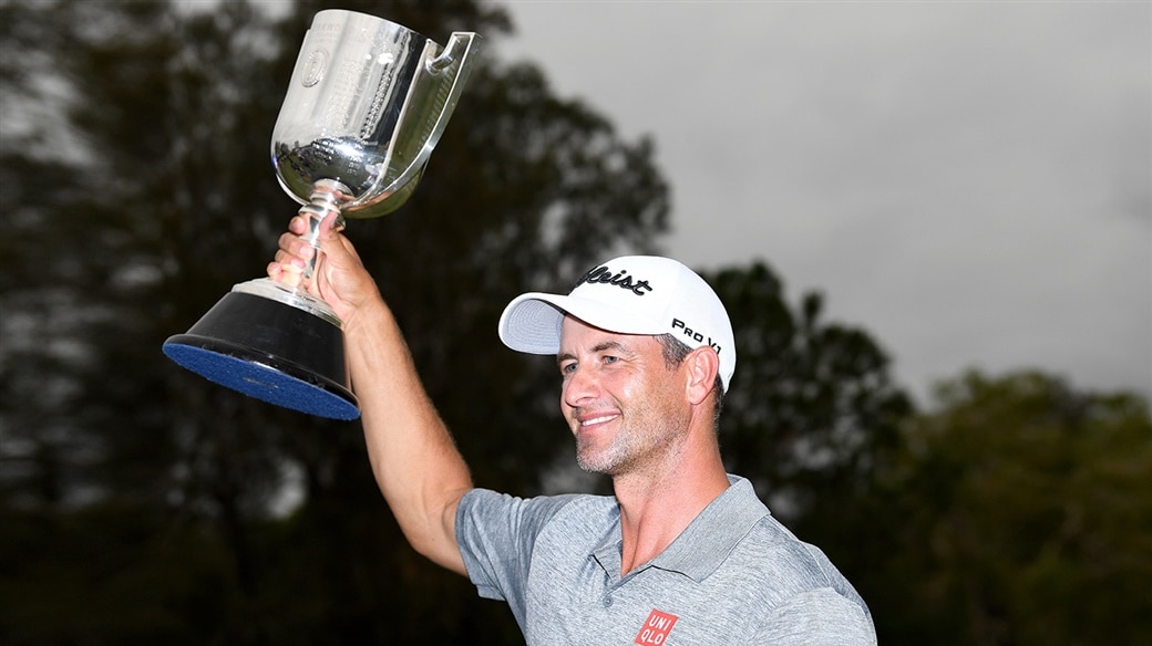 Adam Scott raises the champion's trophy after winning the 2019 Australian PGA Championship.