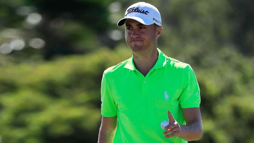 Justin THomas salutes the crod with his Pro V1x golf ball after holing a birdie putt during action on the PGA TOUR in 2019
