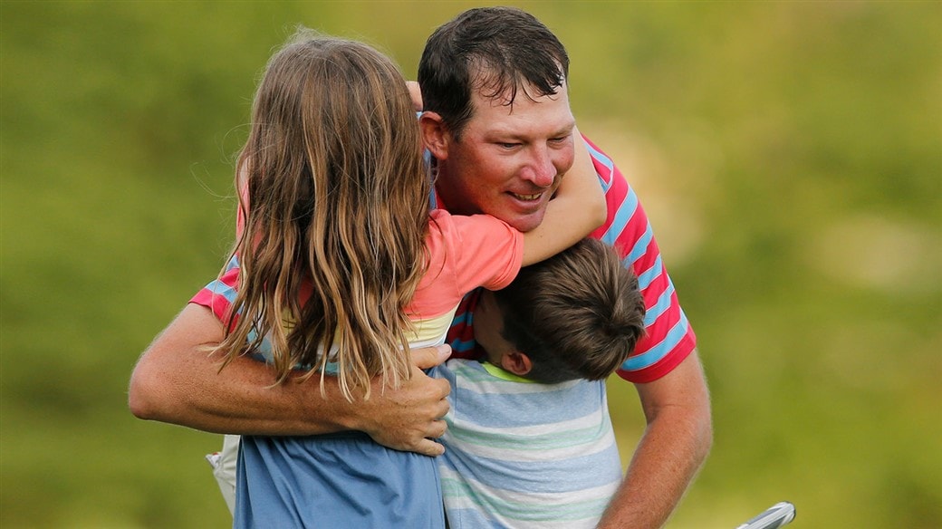 Jim Herman hugs his daughter, Abigail, and son, Andrew, after winning the 2019 Barbasol CHampionship.