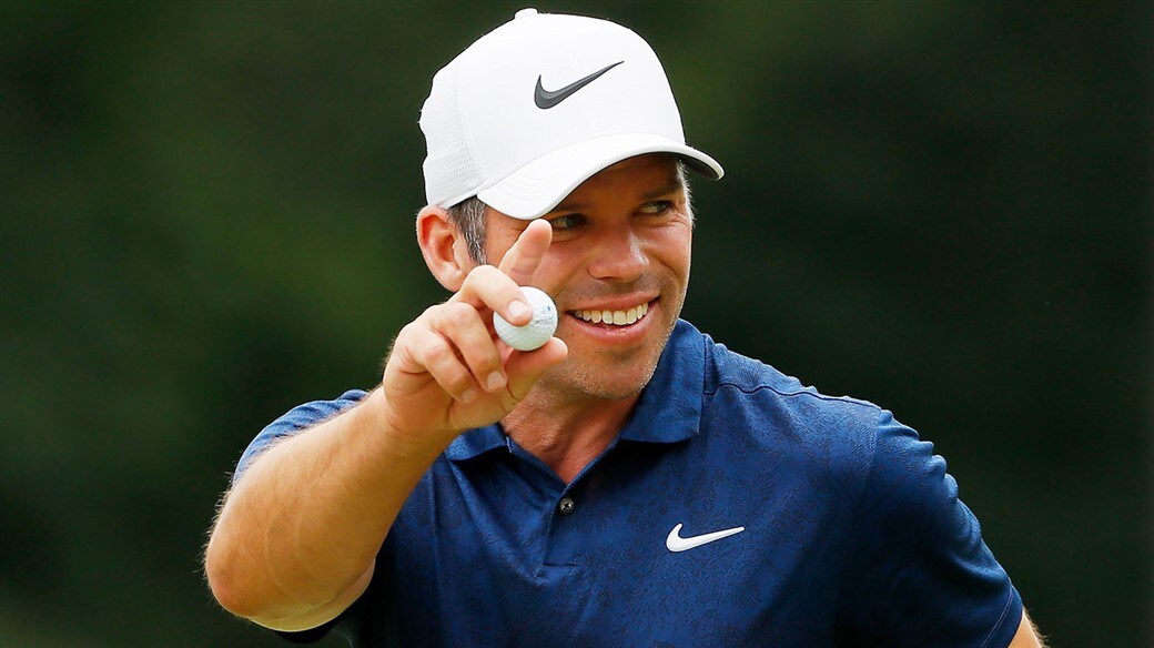 Paul Casey salutes the gallery with his Pro V1 golf ball after holing a birdie putt during action at the 2019 Porsche European Open