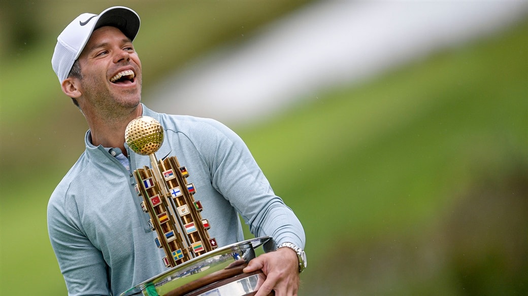 Paul Casey raises the trophy after capturing the 2019 Porsche European Open.