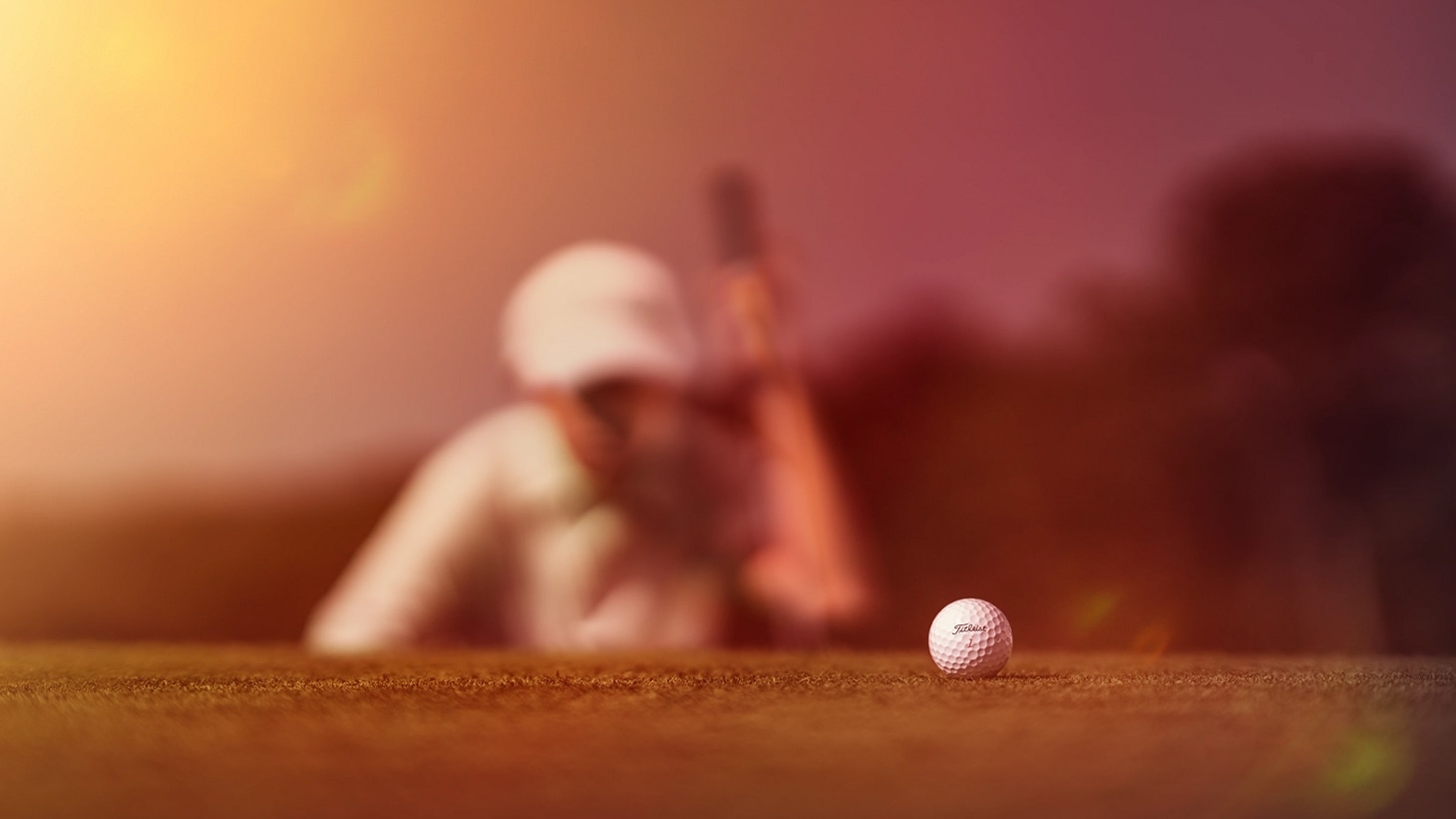 A golfer lines up a putt with his new Titleist Pro V1 golf ball