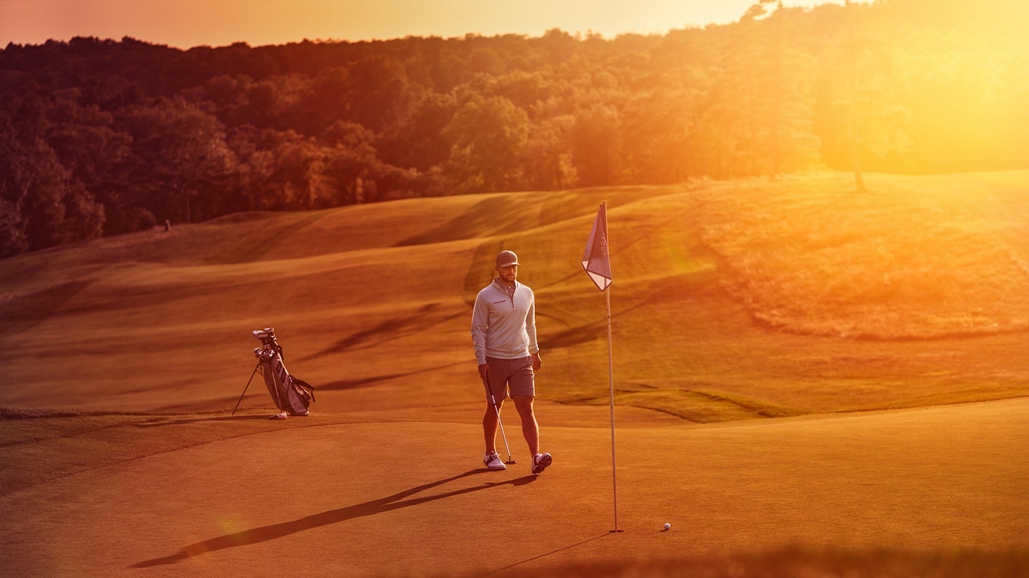 An amateur golfer approaches his new Pro V1 golf ball after hitting a chip shot with precise touch