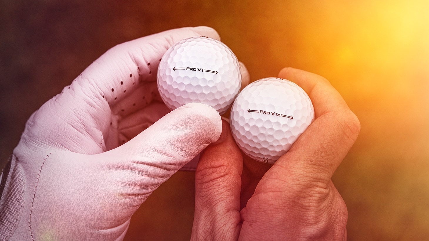 A golfer admires the new sidestamp designs on the 2021 Titleist Pro V1 and Pro V1x golf balls.
