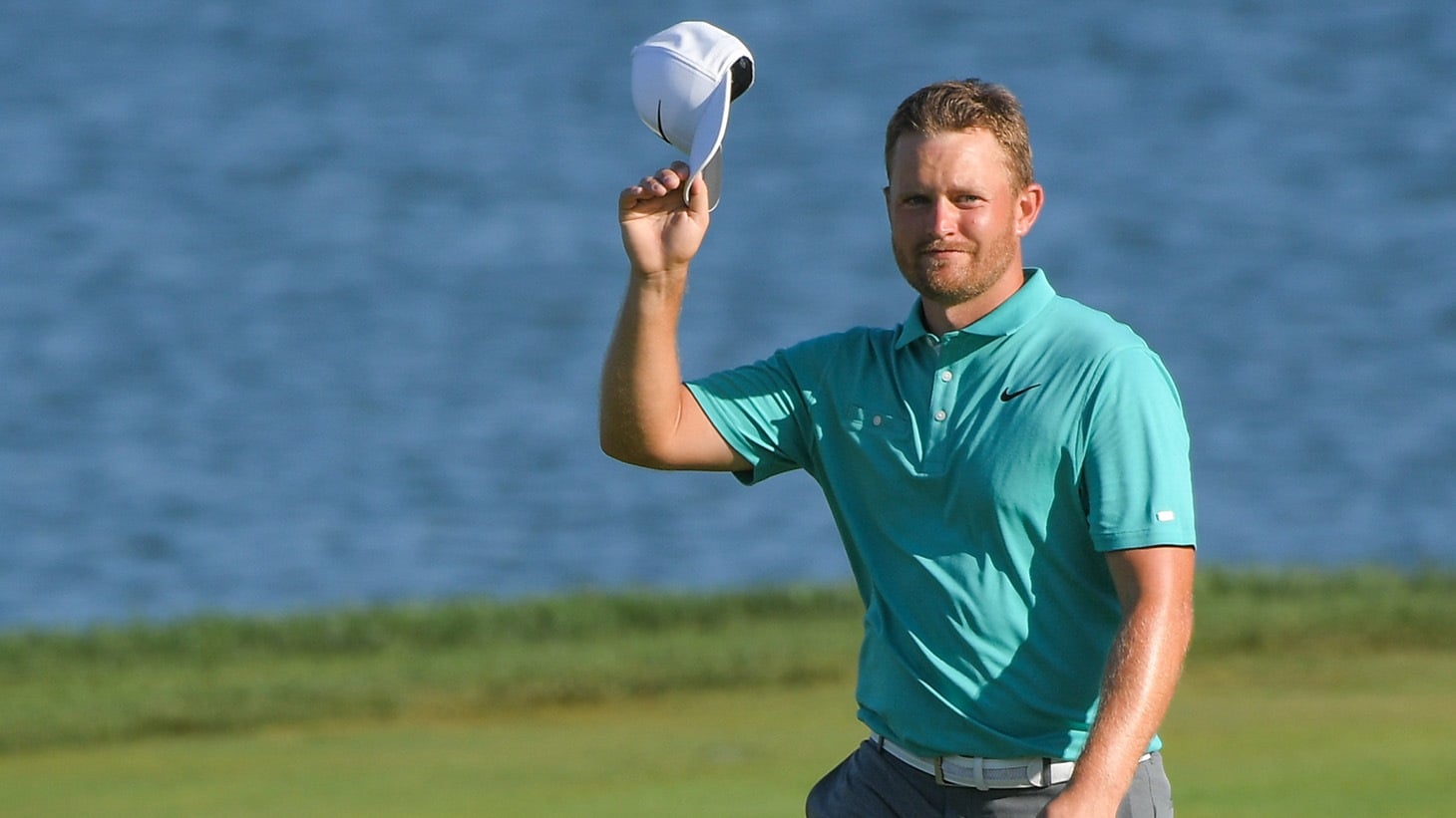 Tom Lewis salutes the crowd after his Pro V1x golf ball falls into the cup at the final hole of the 2019 Korn Ferry Tour Championship