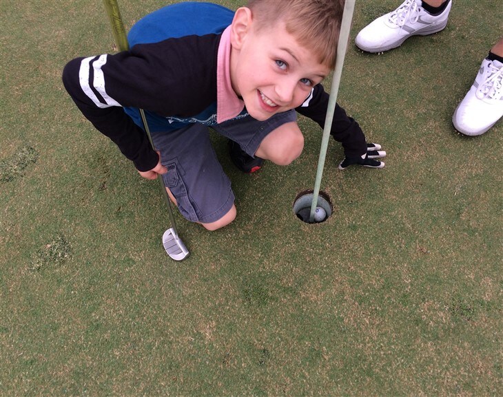 8 year old gets hole in one!